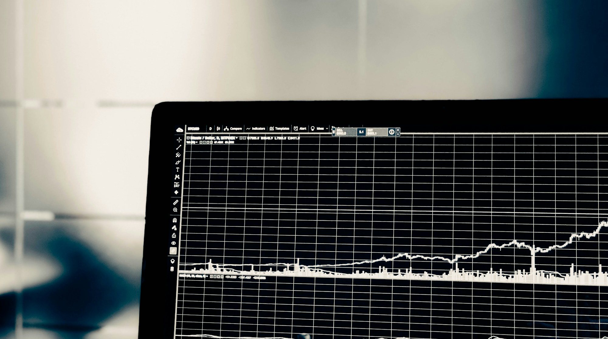 Developer writing code on a widescreen monitor
